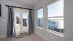 The master bedroom provides beautiful views and has a patio door opening to the lower deck 